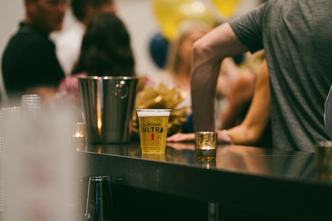 people-enjoy-drinks-at-a-bar-during-an-event-oihgschwji8